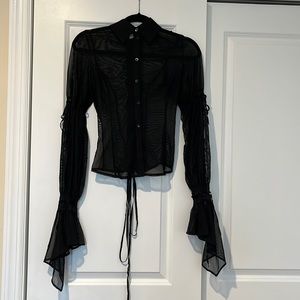 Black sheer long-sleeve blouse. Ties up the back. Size S.